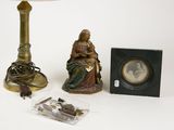 a lamp, a picture frame, and a picture on a table