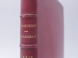 an old book sitting on top of a table next to a white background