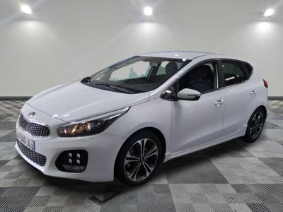 the white car is parked on a checkered floor in a garage