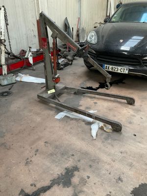 a picture of a car being worked on in a garage