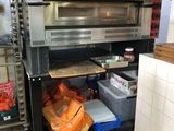 an image of a commercial kitchen with a pizza oven