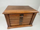 an old wooden chest of drawers on a white background