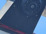 a close up of a camera mounted on the side of a car