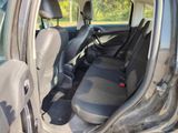 the interior of a car with the door open showing the front seats