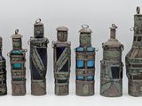 many bottles that are lined up together on a table