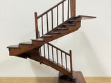 an image of a wooden staircase with a handrail on top of it
