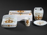 a picture of a white and gold bathroom set
