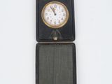 a small black box with a clock inside of it