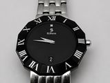 gros plan d'une montre-bracelet avec des chiffres romains