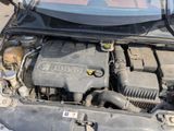 a car engine that is under the hood of the car
