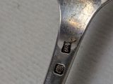 a spoon that has a small hole in the middle of it