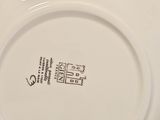 a white plate with a black and white design on it