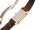 a close up of a brown leather bracelet with a silver clasp