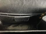 the inside of a black purse with a zipper on top of it