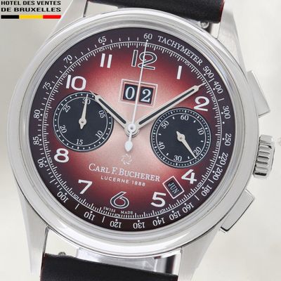 un gros plan d'une montre-bracelet au cadran rouge