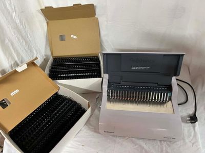 three boxes with different typewriters in them on a white surface