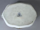 a close up of a white plate with a bicycle on it