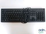a black keyboard and mouse on a white surface