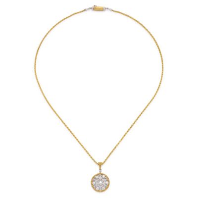 a gold necklace with a white stone pendant on a gold chain