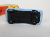a toy car that is sitting next to a box