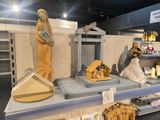 a display of nativity figurines on a shelf in a store