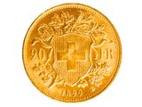 gros plan d'une pièce d'or portant des armoiries