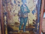 a picture of a man with a hat and a cane on a chair