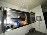 an image of a commercial kitchen with stainless steel cabinets