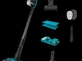 un gros plan d'un aspirateur noir et bleu avec divers accessoires