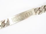 an image of a silver bracelet with a nameplate on it