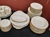 a lot of plates and cups on the table
