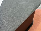 a close up of a table with a metal plate on top of it
