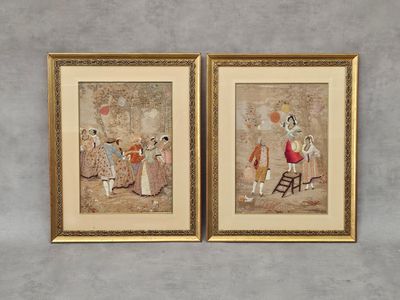 deux tableaux encadrés représentant une femme et un homme avec des parapluies