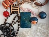a white box filled with assorted jewelry and beads