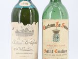 deux bouteilles de vin posées l'une à côté de l'autre sur une surface blanche