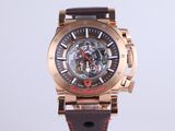 a close up of a watch with a brown strap