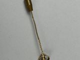 a small metal object that is on a white surface