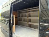 a black van that is parked in a parking lot