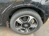 a close up of a tire on a black car