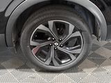 a close up view of a car ' s wheel on the ground