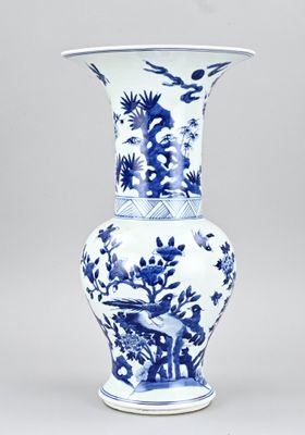 blue and white vase with birds and flowers on it