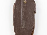 statue of a bear with a bird on its back on a wooden base