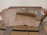a cardboard bag sitting on the floor in front of some boxes