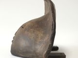 an image of a bronze sculpture of a bird on a white background