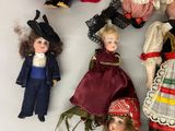 a lot of dolls that are sitting on a table