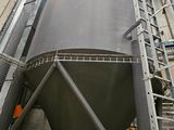 a large metal tank that is inside of a building