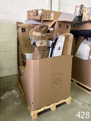many boxes that are stacked on pallets in a warehouse