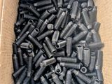a box filled with lots of nuts and bolts sitting on top of a table
