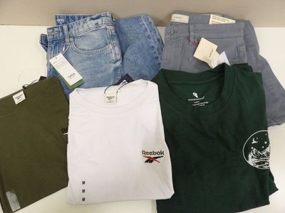 a lot of clothes that are on a table