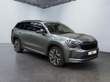 the grey suv is parked in a large room with white walls